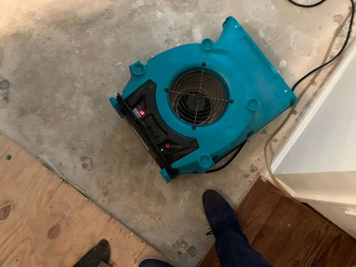 Air mover drying subfloor during Commercial Water Damage Restoration in Mauldin